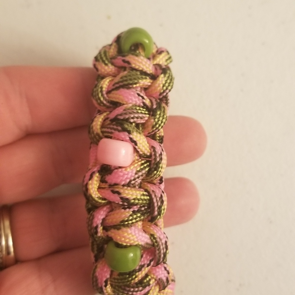Handcrafted pink camo paracord beaded bracelet